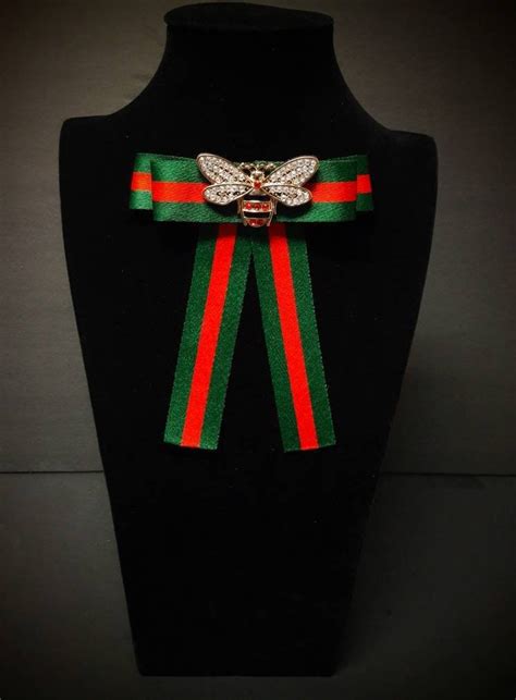 gucci broche|Gucci bow tie brooch.